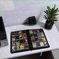 a binder of cards sits on a table. it has 16 slots on each page.